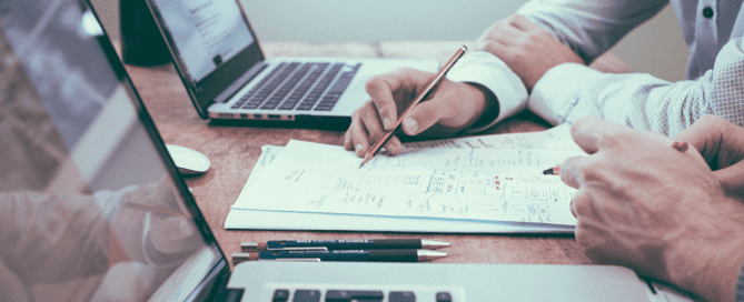 Two employees working at a desk